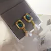 Nuevos pendientes de mujer de moda para comercio electrónico transfronterizo europeo y americano: perla natural, moda vintage popular, aretes creativos para dama