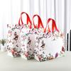 Bolsa de tela no tejida con logotipo personalizado para tienda de ropa, bolsa de regalo publicitaria, bolsa de compras con película, venta al por mayor