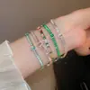 [Cadena de Diamantes Arcoíris] Pulsera de extracción de zircón trenzado en cruz, una pulsera lujosa y de alta gama, una pieza de joyería delicada y de moda