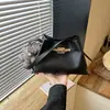 Elegante bolso de mujer 2026 modelo nuevo, color liso con patrón de lichi, moderno bolso tipo cubo, bolso de hombro y cruzado elegante y versátil