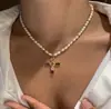 Colar de cristal colorido com blocos de cores cruzados transfronteiriço feminino design de nicho senso de temperamento corrente de clavícula de zircônia super brilhante