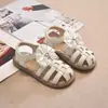 Sandálias Romanas de Tecido Infantil 2026 Verão Nova Versão Coreana Sapatos de Princesa com Laço de Renda para Combinar com Vestidos