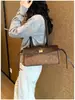 Bolso de mujer con patrón de rombos único, nuevo modelo de verano 2026, de alta gama y súper popular, bolso de mano pequeño para el trabajo y artículos varios, bolso de hombro y para llevar debajo del brazo