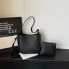 Bolso cruzado casual de diseño de nicho de moda transfronterizo, patrón simple de lichi, bolso de alta gama para madre e hija para ir al trabajo, bolso cruzado versátil