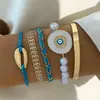 Set de pulseras de aleación multicapa transfronterizas europeas y americanas, con un diseño moderno y sofisticado con mariposas de esmalte y gemas incrustadas de diamantes