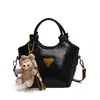 Bolso de cubo portátil de diseño nicho de estilo coreano de moda nuevo de este año, temperamento de alta gama, combina con todo, para llevar al hombro o cruzado, bolso de mujer