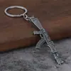 Venta al por mayor transfronteriza mini pistola de metal colgante para coche para hombre supervivencia Jedi periférico modelo de simulación llavero de pistola
