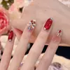 2026 Dança do Leão Cereja Vermelha Gatinho Olho de Gato Outono/Inverno Novo Estilo Elegante Clareador Arte de Unhas Feita à Mão Pontas de Unha Atacado