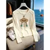 Elegante camiseta de manga larga ajustada para mujer, nuevo modelo otoño 2026, simple y chic, versátil, color albaricoque, top de algodón puro