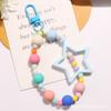 Nuevo llavero colgante de estrella hueca de cinco puntas de dopamina, accesorios de cadena de bolitas de color fresco pequeño, decoración para estuche de audífonos
