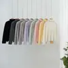 Tejido de punto para mujer de cachemira sin costuras de cuello alto y manga larga
