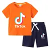 Camiseta infantil 2022 TikTok verano nueva ropa infantil de comercio exterior coreana pantalones cortos de manga corta para niños traje de dos piezas