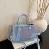 Bolso de hombro de color block popular para mujer, otoño temprano 2026, bolso de mano casual de moda, bolso elegante para ir al trabajo, bolso de mujer al por mayor