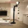 Lámpara de escultura abstracta de bola de personaje Lámpara de sala de exposiciones lámpara de oficina de ventas de hotel Lámpara de decoración artística lámpara de león lámpara de pie con forma humana
