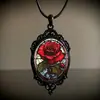 Collar Colgante de Vidrio Ovalado Encantador de Nuevo Producto Transfronterizo - Rosa Roja en Marco Negro Retro Venta al por Mayor