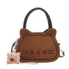 Bolsa Pequena Bordada Doce e Fofa para Mulheres 2025 Nova Bolsa de Mão Gatinho Retro Fosca Bolsa Transversal Texturizada Outono e Inverno