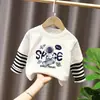 Camiseta base para niño 2026 nuevo modelo camiseta de manga larga a rayas patchwork para niños top de algodón puro otoño para niños mayores