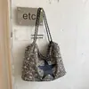 Bolso estampado de leopardo para mujer, nuevo modelo de otoño 2026, nicho de alta gama, bolso tote súper popular para el día a día, bolso de hombro de gran capacidad