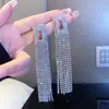 Brincos de franja exagerados com strass, estilo socialite europeu e americano, luxo leve, personalidade, moda, brincos de festa, brincos de noiva para casamento