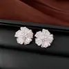 Pendientes de borla con flor de trébol de circonita vintage con un toque de alta gama, pendientes versátiles y de moda al por mayor