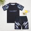Traje de baño para niños más vendido Verano Nuevo Estudiante Natación Simple Atractivo Traje de baño Niño Dividido Manga Corta Traje Transfronterizo