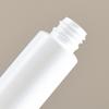 Empaque de arroz de madera en stock Botella de manguera puntiaguda de PE Botella cosmética con bomba Botella de plástico para prueba de emulsión de aceite esencial de pequeña capacidad