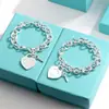 Pulsera para Pareja Etiqueta Inglesa en Forma de Corazón Marca T Cierre de Amor Ot Esmalte Azul Anillo de Corazón Melocotón Joyería Estilo Ins Transfronterizo