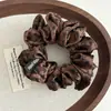 Goma para el pelo de tela con estampado de leopardo, mismo estilo que la bloguera coreana, estilo retro de alta gama para chicas populares, liga para coleta, goma para el pelo con flor