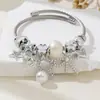 Pulsera familia Pan explosiones transfronterizas pulsera de cuentas DIY gato de perla lazo estrella de cinco puntas moda joyería