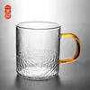 Suministro puntual de fábrica vaso de vidrio para té verde con patrón de malla de martillo transparente Marca de ocio de vidrio de borosilicato alto Taza de leche