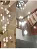 Escalera de villa candelabro largo 2026 nuevo modelo loft minimalista apartamento pequeño techo abierto bola burbuja candelabro de cristal