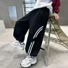 Outono 2026 Meninos Barras Paralelas Calças Esportivas Largas Joggers Novas Infantis Cor Sólida Moda Casual