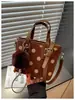 Bolso de mano de lunares de moda para mujer, nuevo bolso cubo de estilo coreano de nicho para el día a día, bolso de hombro y cruzado