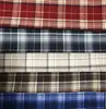 Nuevo tejido de otoño e invierno elástico a cuadros cepillado falda JK ropa para niños camisa para mujer pantalones para hombre tejido teñido en hilo en stock venta al por mayor