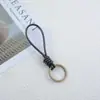 Pulsera tejida a mano cuerda de cuero llavero pareja simple colgante tejido cuerda de cuero vintage cuerda de llave colgante de bolsa joyería