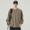 Camiseta de manga larga para hombre, nuevo modelo otoño 2026, cuello redondo, corte holgado, casual, con bolsillos, color liso, versátil y moderna