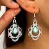 Pendientes de alta gama vintage europeos y americanos transfronterizos, pendientes huecos de estilo bohemio con forma de gota de turquesa tallada