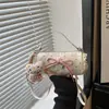 Bolsa de mão fashion e doce estilo coreano com laço e poá, compacta e estilosa, elegante bolsa transversal cilíndrica