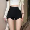Shorts ajustados elásticos negros para mujer, nuevo estilo verano y otoño 2025, de cintura alta, adelgazantes, adecuados para usar en exteriores, sexys y modernos, diseño corto irregular