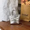 Bolso de Mano de Lunares con Lazo Nuevo de Verano 2026 Bolso de Mujer de PU Bolso Cubo Simple Elegante de Hombro Cruzado