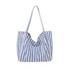 Bolso tipo cubo a rayas de bloques de color único para mujer, nuevo bolso de hombro y cruzado de moda 2026, bolso tote a la moda para niñas