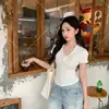 Top chic y versátil de estilo francés para mujer, con escote en V y manga corta, que estiliza la figura, nuevo diseño de verano con hombro estructurado