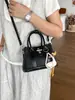 Bolso de mano pequeño transfronterizo para mujer, nuevo bolso de hombro texturizado de moda de verano 2026, bolso cruzado tipo cubo para el trabajo