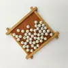 Perla de imitación de agujero medio de aguja única para resaltar el abdomen con accesorios de diamante colgante de perla suelta blanca hecho a mano para bricolaje al por mayor