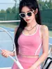 Top deportivo de bloques de color personalizado con tacto nude, espalda descubierta hermosa, falda deportiva de línea A de cintura alta, conjunto de fitness para exteriores
