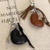 Collar Colgante de Corazón y Cruz de Cuero Maillard Cadena Larga con Borla para Suéter Diseño Dulce y Fresco Cadena para el Cuello