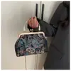 Bolso de clip listo para usar transfronterizo, nuevo bolso de moda estilo étnico 2025 cheongsam, hermoso bolso de mano, elegante bolso de hombro y cruzado