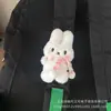 Lindo juguete de peluche al por mayor colgante para mochila muñeca de peluche de dibujos animados bolsa de puesto llavero Velcro colgador de bolsa de estudiante