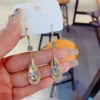 2025 Novos Cristais Roxos da Moda de Alta Qualidade em Formato de Gota para Orelha, Brincos Simples e Elegantes, Acessórios de Orelha Modernos e Estilosos