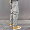Pantalones Casuales Sueltos Cónicos Funcionales Softshell a Prueba de Agua, Viento y Polvo Estilo Americano Transfronterizos con Múltiples Bolsillos para Hombres y Mujeres